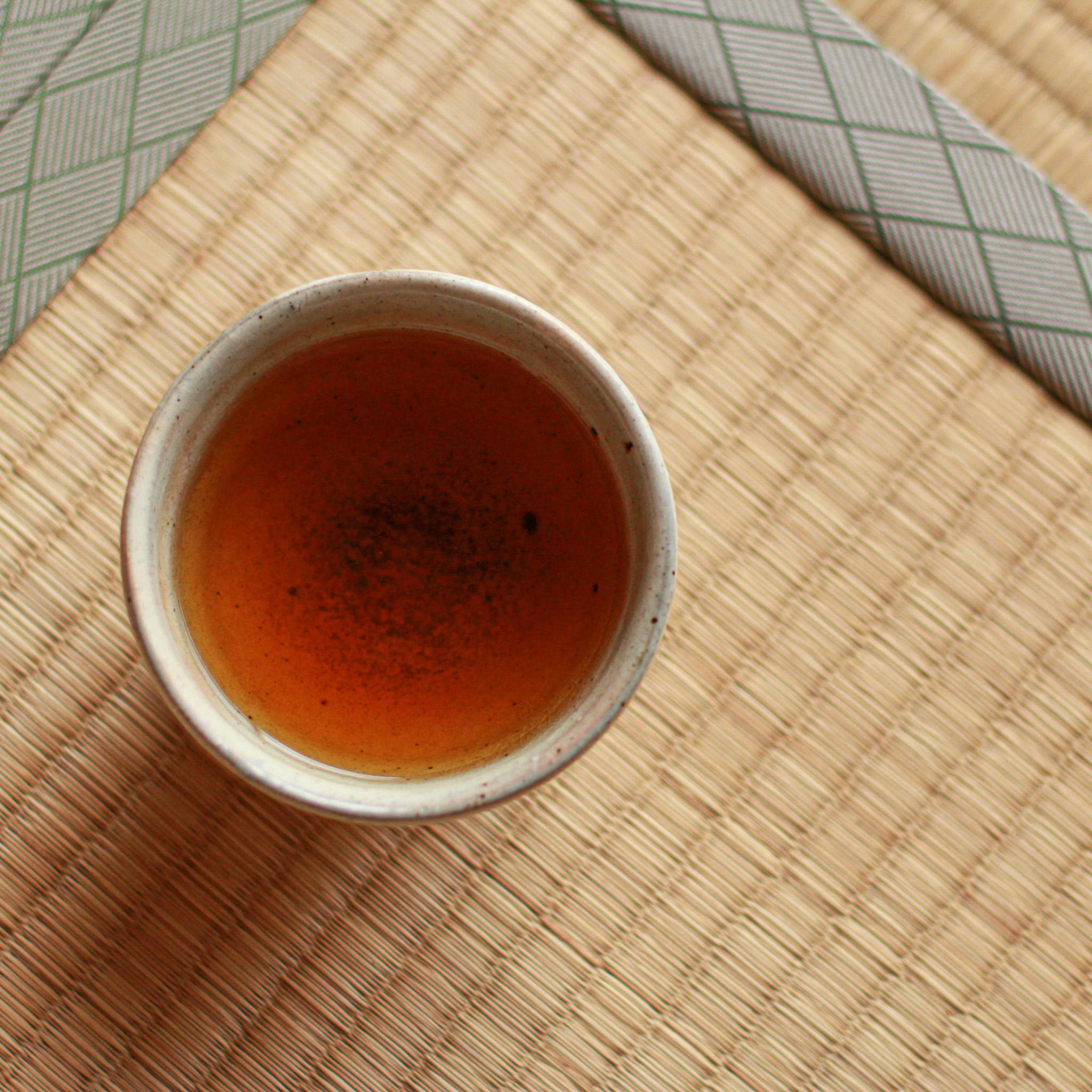 Freshly brewed Japanese tea served in artisan teacup
